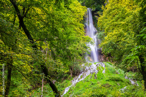 Obraz na płótnie Germany, Impressive 37m high waterfall of climatic spa region in green forest of bad urach in swabian jura nature landscape, a popular tourist attraction w salonie