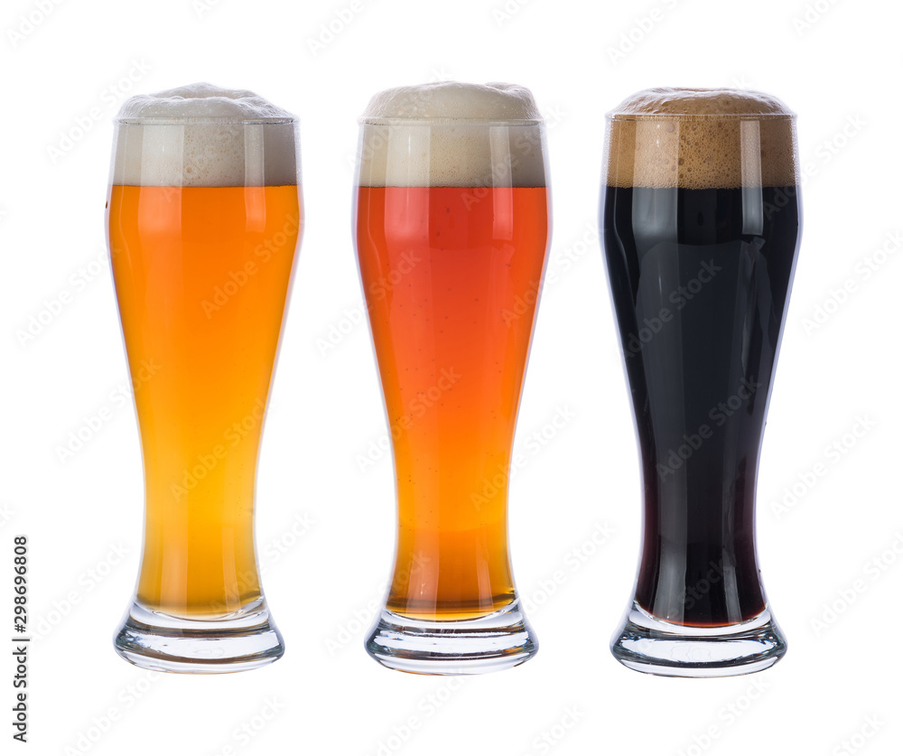 Three glasses with different beers isolated on a white background. Three glasses with different beers isolated on a white background.