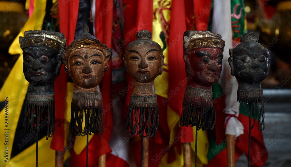 Line of traditional wooden head statues at a Chinese temple Line of traditional wooden head statues at a Chinese temple