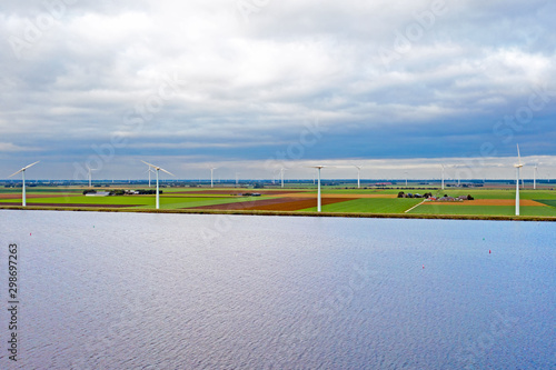 Aerial from windmills at the waterfront in the countryside from the Netherlands photo