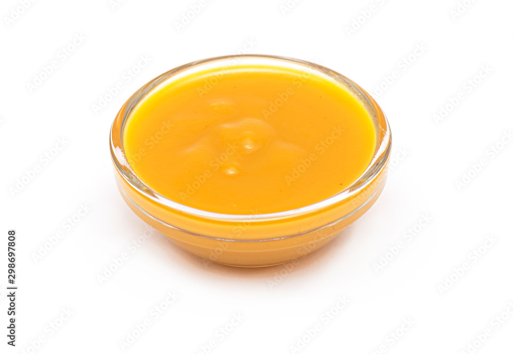 Mango Puree in glass Bowl, Mango Fruit Puree isolated on white Background