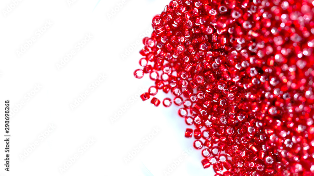 Close up Colorful red glass beads. beaded necklace or a string of beads for women Close up Colorful red glass beads. beaded necklace or a string of beads for women