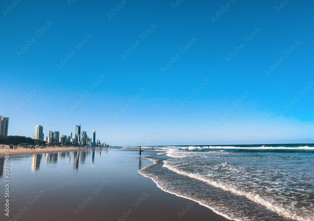 Beautiful wide panoramic view of the Gold Coast skyline and Surfers Paradise beach with rolling waves of Pacific ocean. Beautiful wide panoramic view of the Gold Coast skyline and Surfers Paradise beach with rolling waves of Pacific ocean.