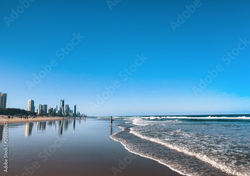 Beautiful wide panoramic view of the Gold Coast skyline and Surfers Paradise beach with rolling waves of Pacific ocean.