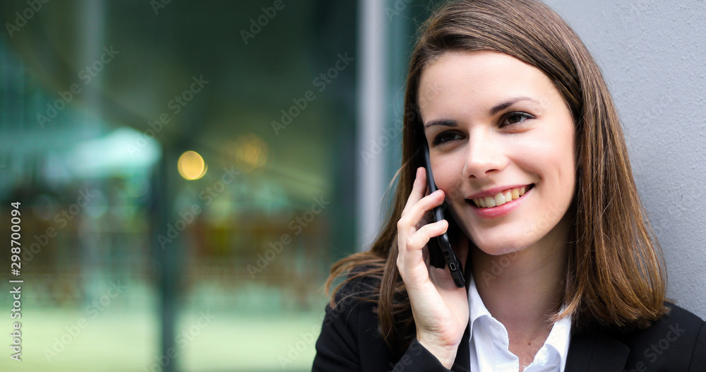 Portrait of a young woman talking on the phone