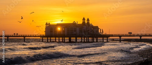 Fototapeta Naklejka Na Ścianę i Meble -  Sellin Pier in beautiful golden morning light at sunrise .Ostseebad Sellin tourist resort, Baltic Sea , Germany