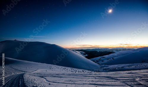 Empty ski resort under the moonlight at night