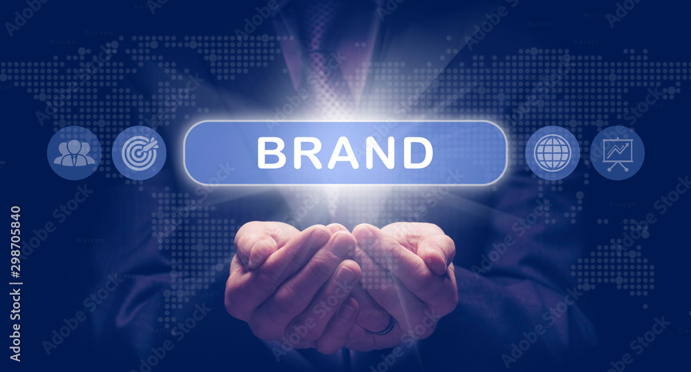 Businessmans cupped hands holding a Brand business concept on a computerised display. Businessmans cupped hands holding a Brand business concept on a computerised display.