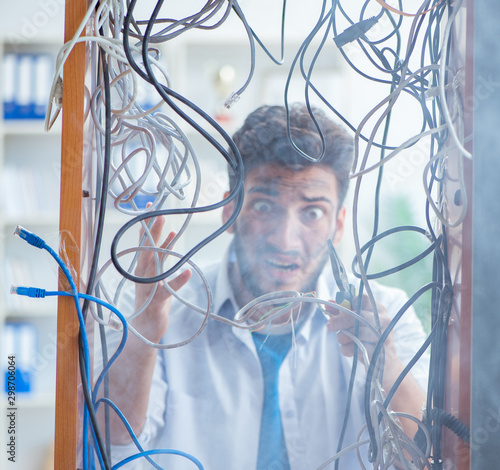 Electrician trying to untangle wires in repair concept