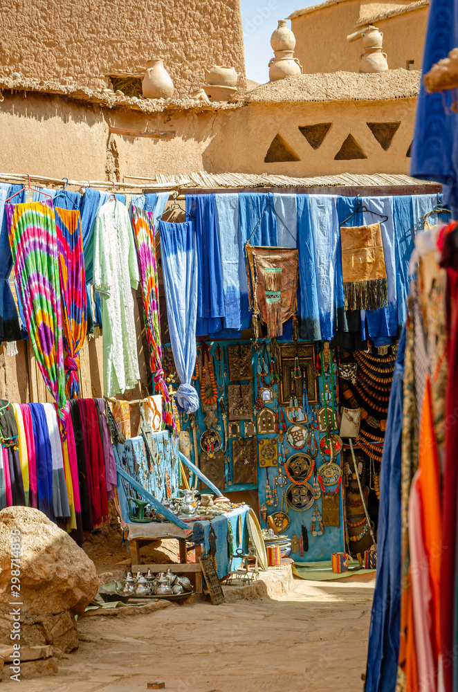 Souvenir shop and chilabas at the Kasbah Ait Ben Haddou in Ouarzazate, Morocco October 2019