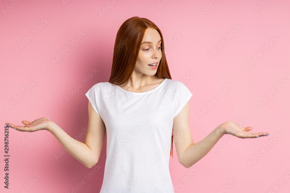 Portrait of young happy redhead woman in white t shirt Portrait of young happy redhead woman in white t shirt