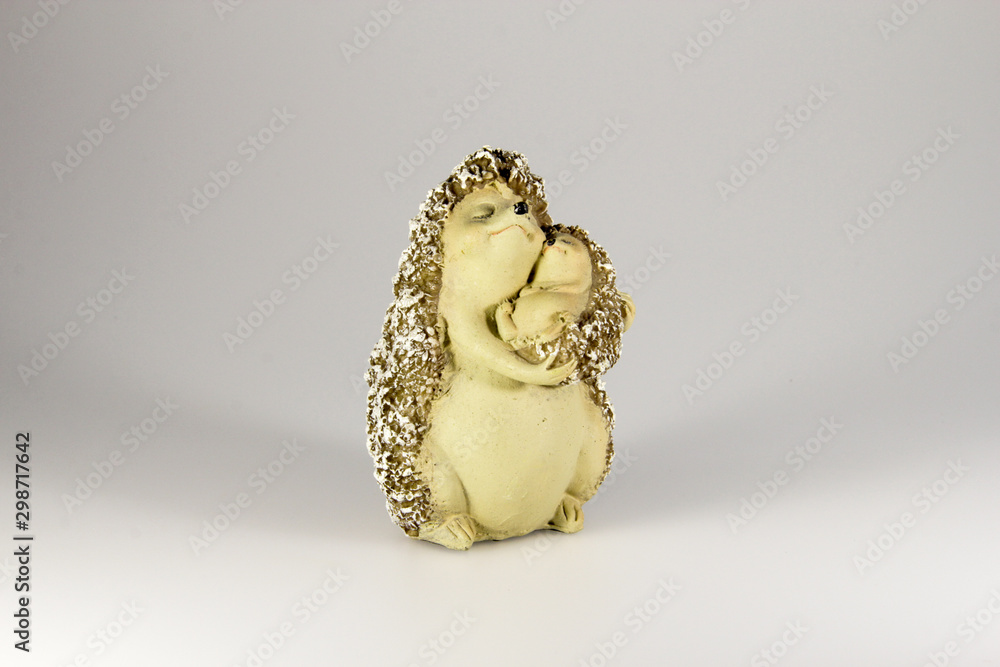 collection of cute little hedgehog in gray background figurines with book, cello, apples, hugs, lovers, shell