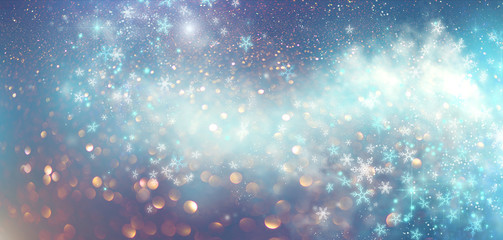 Winter Christmas and New Year glittering snow flakes swirl bokeh background, backdrop with sparkling blue stars, holiday garland, magic glowing stars, lights. Abstract Glitter Blinking sparks