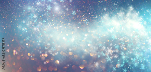 Winter Christmas and New Year glittering snow flakes swirl bokeh background, backdrop with sparkling blue stars, holiday garland, magic glowing stars, lights. Abstract Glitter Blinking sparks