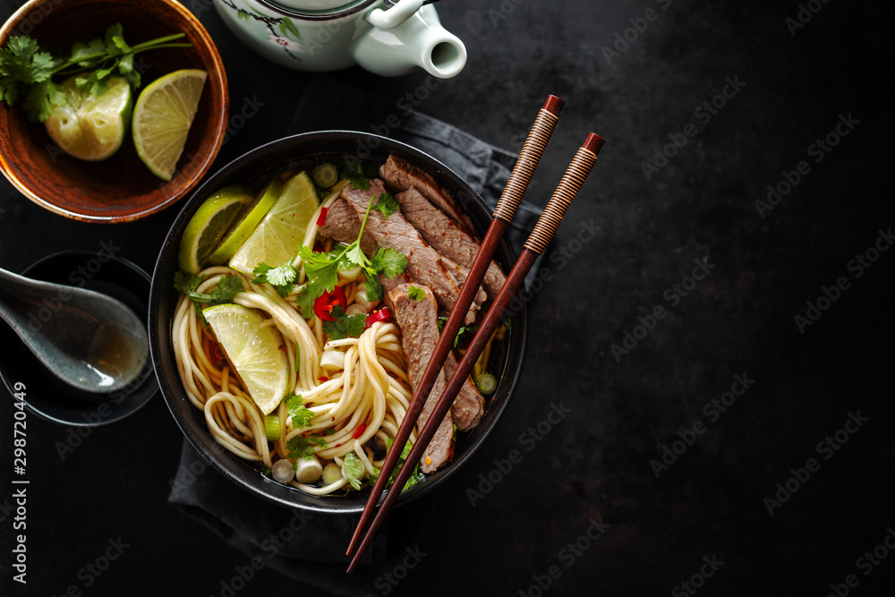 Tasty asian classic soup with noodles and meat - obrazy, fototapety, plakaty 