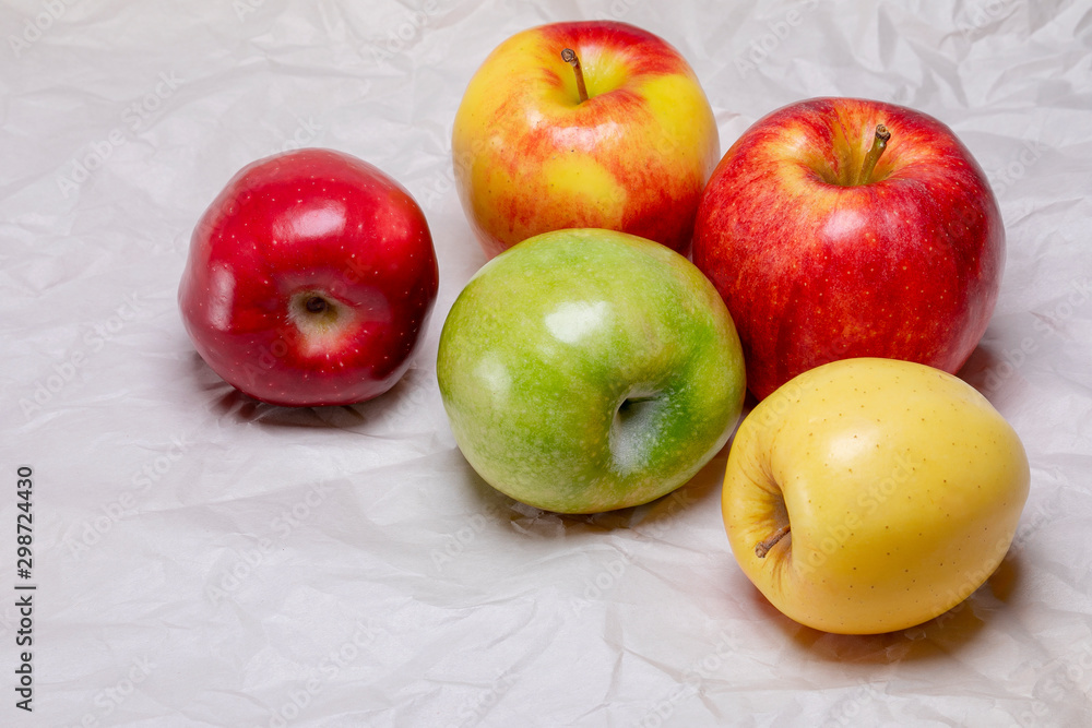 A variety of colorful and healthy yellow, green and red apples A variety of colorful and healthy yellow, green and red apples
