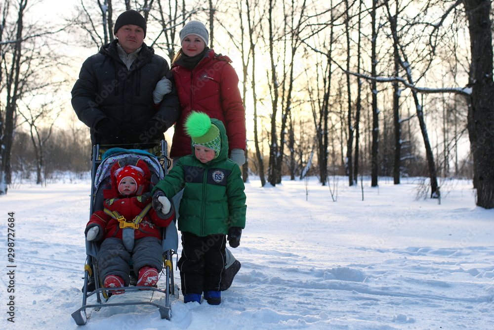 Young family with children in winter