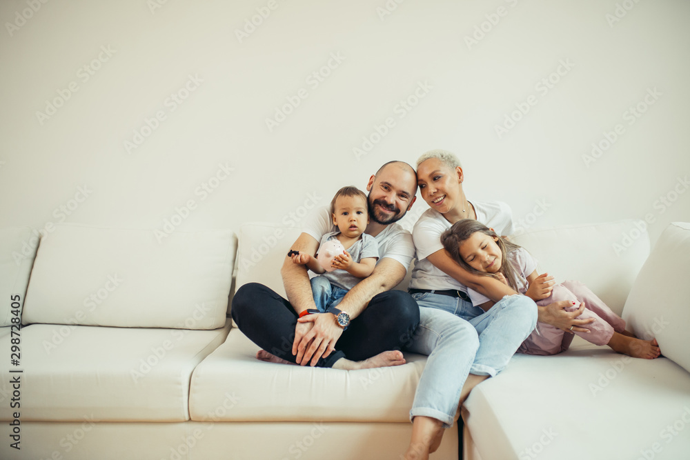 Enjoying family relax at home, Portrait of beautiful caucasian family sitting on sofa. Family, children concept
