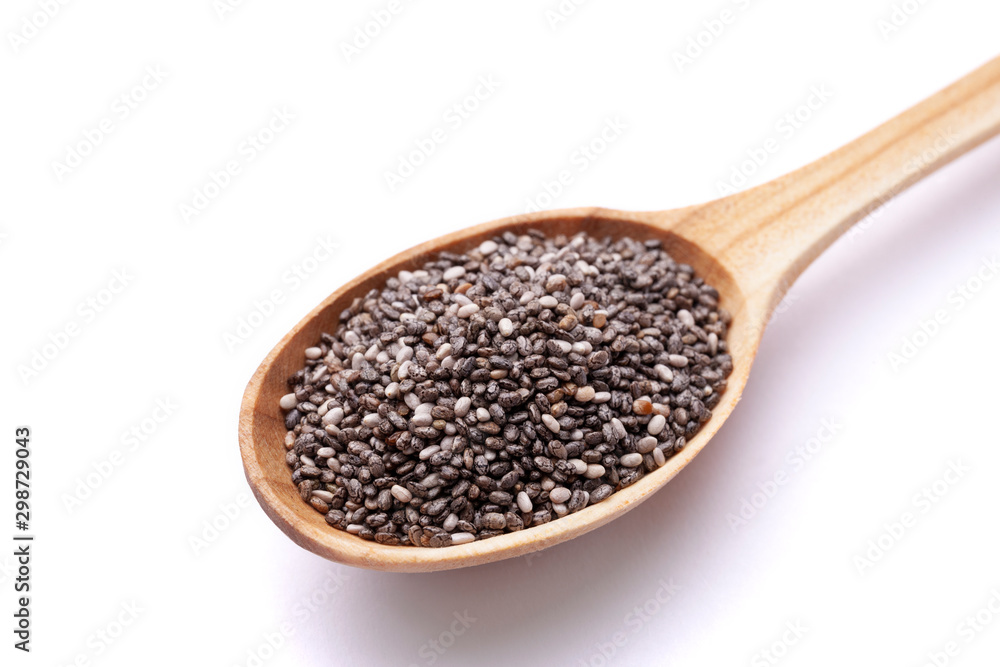 Chia seeds in wooden spoon isolated on white background. Superfood concept Chia seeds in wooden spoon isolated on white background. Superfood concept