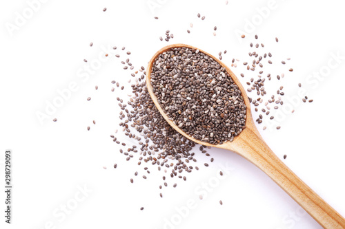 Chia seeds in wooden spoon isolated on white background. Superfood concept. Top view