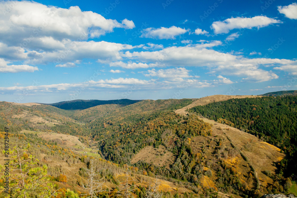 Fototapeta premium Beautiful mountain landscape, with mountain peaks covered with forest and a cloudy sky. Ukraine mountains, Europe
