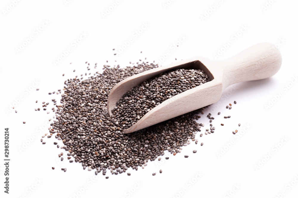 Chia seeds in wooden scoop isolated on white background. Superfood concept. Top view, closeup view Chia seeds in wooden scoop isolated on white background. Superfood concept. Top view, closeup view