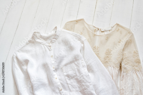 Embroidered blouse and white shirt on a white background. Clothing concept