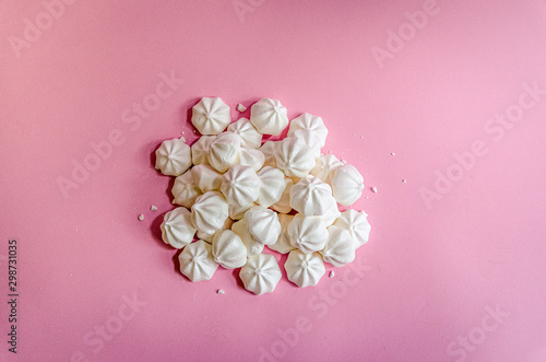 Sweet white meringue on fresh pink background