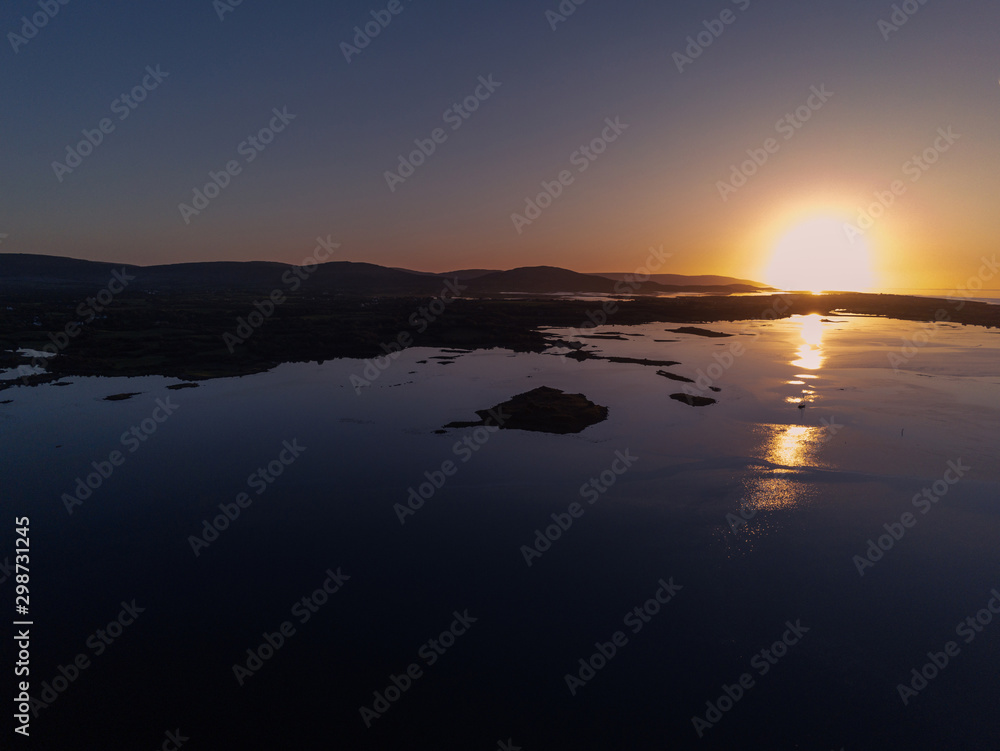 Fototapeta premium Oyster farming in the ocean, Aerial view. Galway bay, Atlantic ocean. Calm sunset.