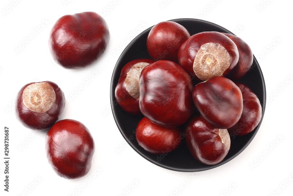 chestnuts in a black plate isolated on white background. top view chestnuts in a black plate isolated on white background. top view