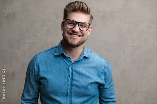 Happy casual man laughing and looking forward