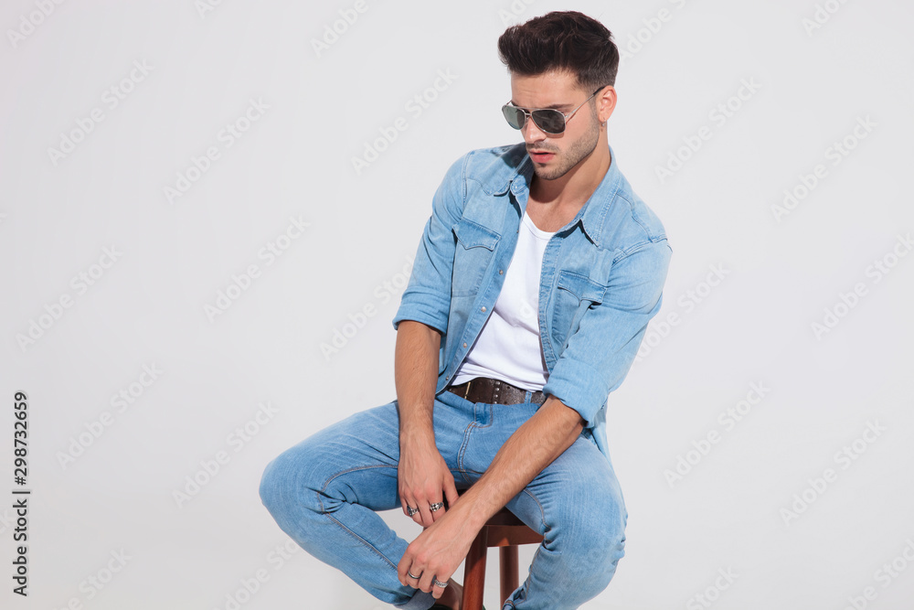 Pensive casual man looking away and wondering Pensive casual man looking away and wondering