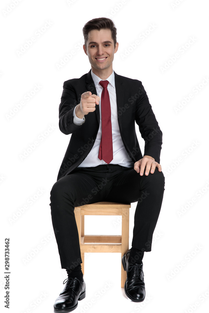 Attractive businessman pointing forward Attractive businessman pointing forward