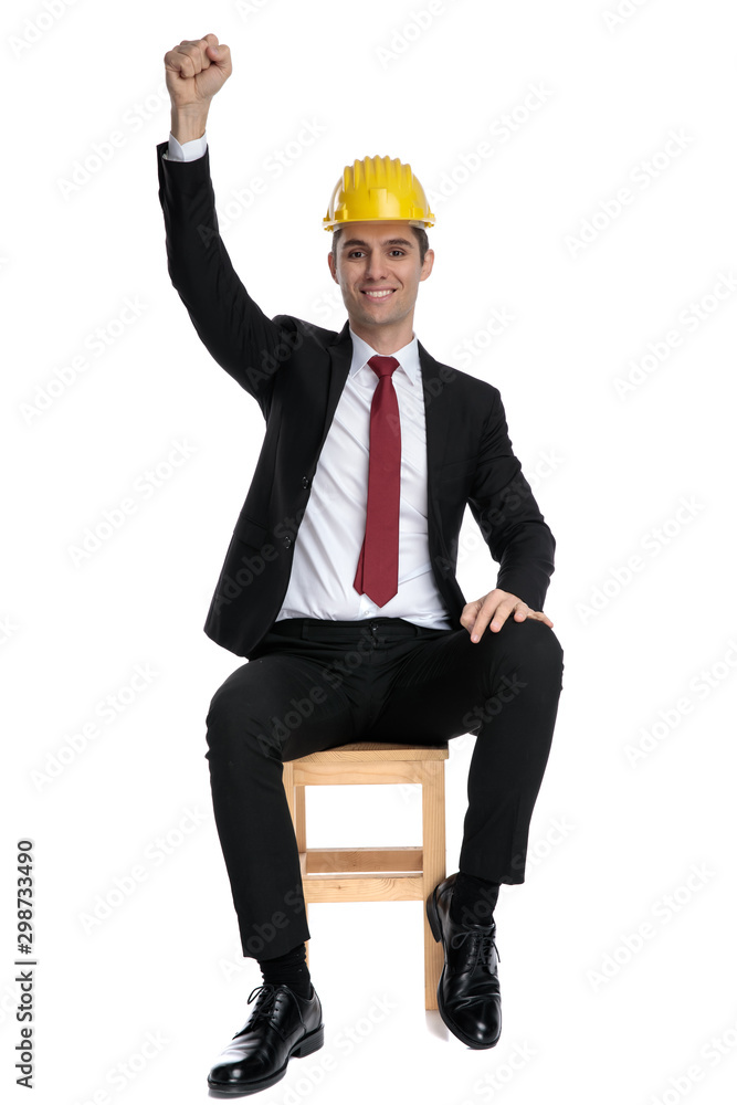 Successful businessman celebrating with his fists in the air Successful businessman celebrating with his fists in the air