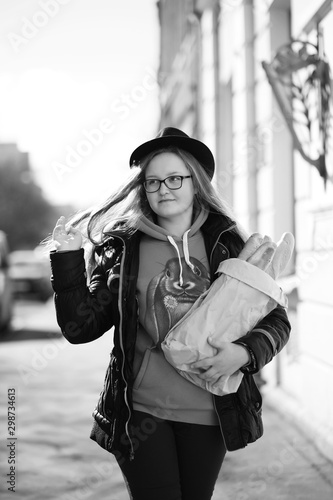 Black and white photo of a young girl on a walk