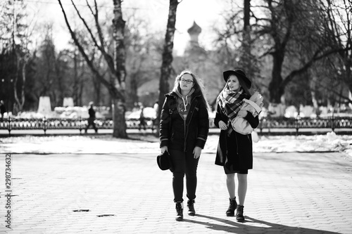 Black and white photo of a young girl on a walk