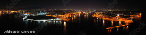 Aerial drone night shot of beautiful illuminated port of Piraeus and huge cruise liner departing to Aegean popular destinations, Attica, Greece © aerial-drone