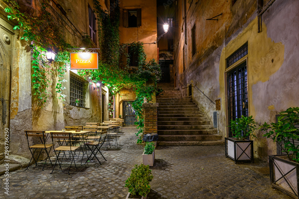 Night view of old street in Rome, Italy. Architecture and landmark of Rome. Cozy cityscape of Rome