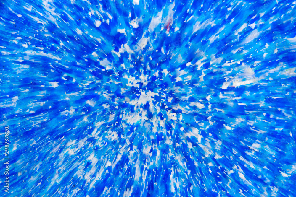Obraz premium Bright abstract background of blue and white paint splashes.