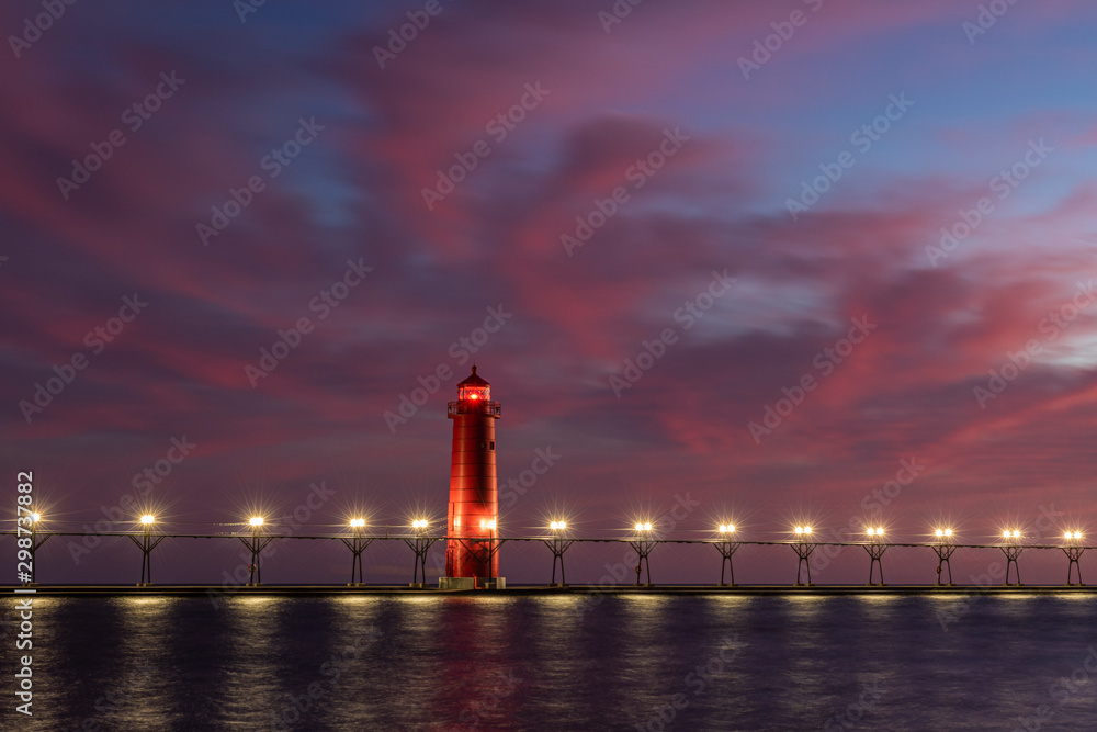 lighthouse at night with afterglow
