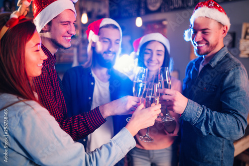 Photography New year glasses for champagne in the hands of friends