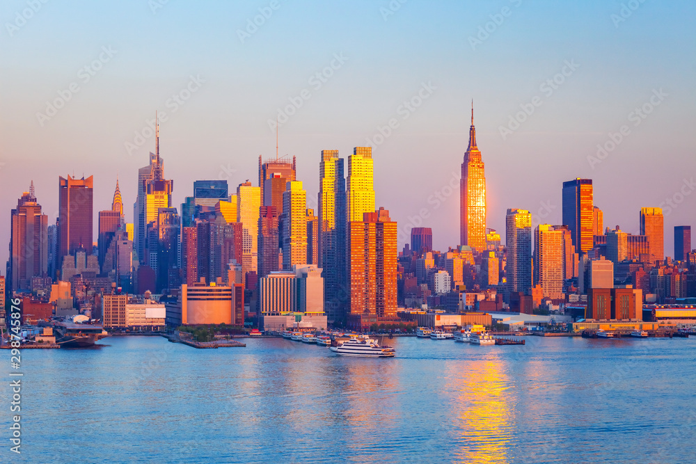 Manhattan skyline illuminated by sunset