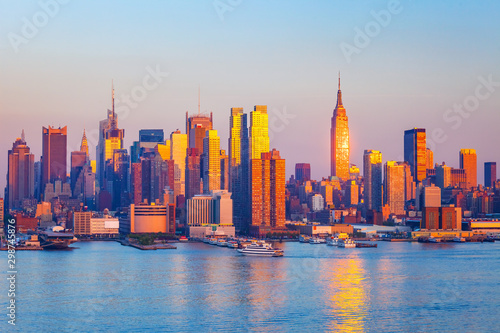 Manhattan skyline illuminated by sunset