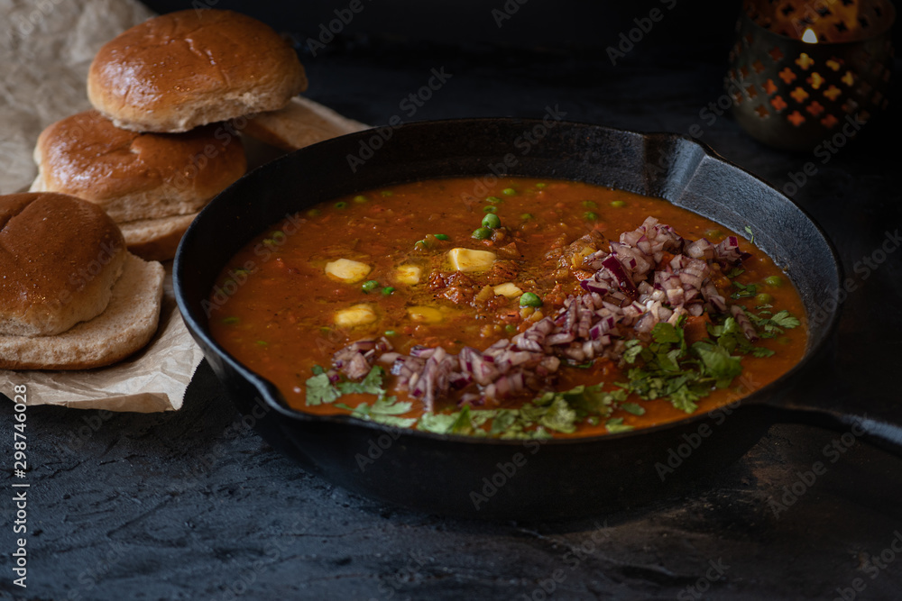 Pao bhaji- Indian mixed vegetable curry served with buttered buns Pao bhaji- Indian mixed vegetable curry served with buttered buns