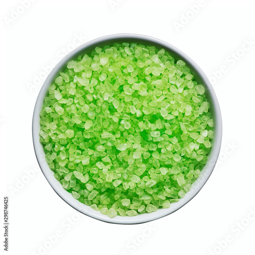 SPA concept. Green bath salt in bowl isolated over white background with clipping path. Top view