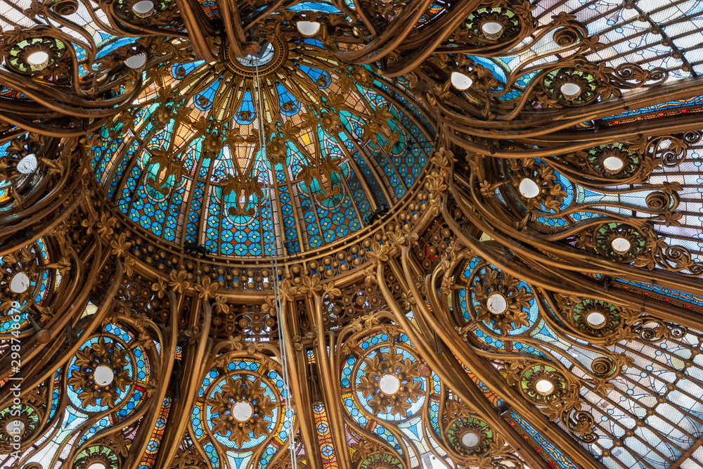 Elaborate stained glass domed ceiling with Golden framework
