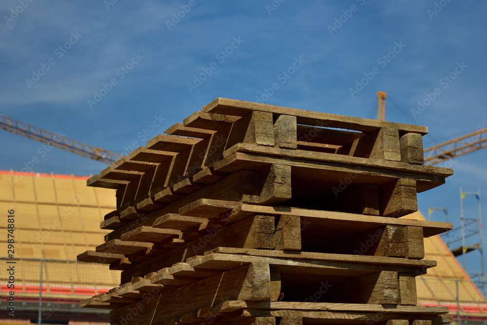 Wooden pallets are stacked on a construction site Wooden pallets are stacked on a construction site