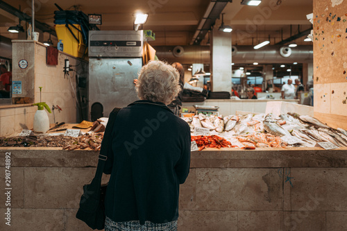 Fototapeta Naklejka Na Ścianę i Meble -  CAGLIARI, ITALY / OCTOBER 2019: Fish vendors at the San Benedetto food market