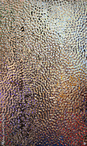 Colorful glitter background texture. Multicolor shiny foil paper  close-up.