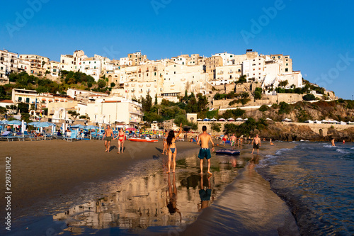 Fototapeta Naklejka Na Ścianę i Meble -  August 12, 2019, Sperlonga, Italy, view on old town Sperlonga and clowded beach during August holidays in Lazio, Italy